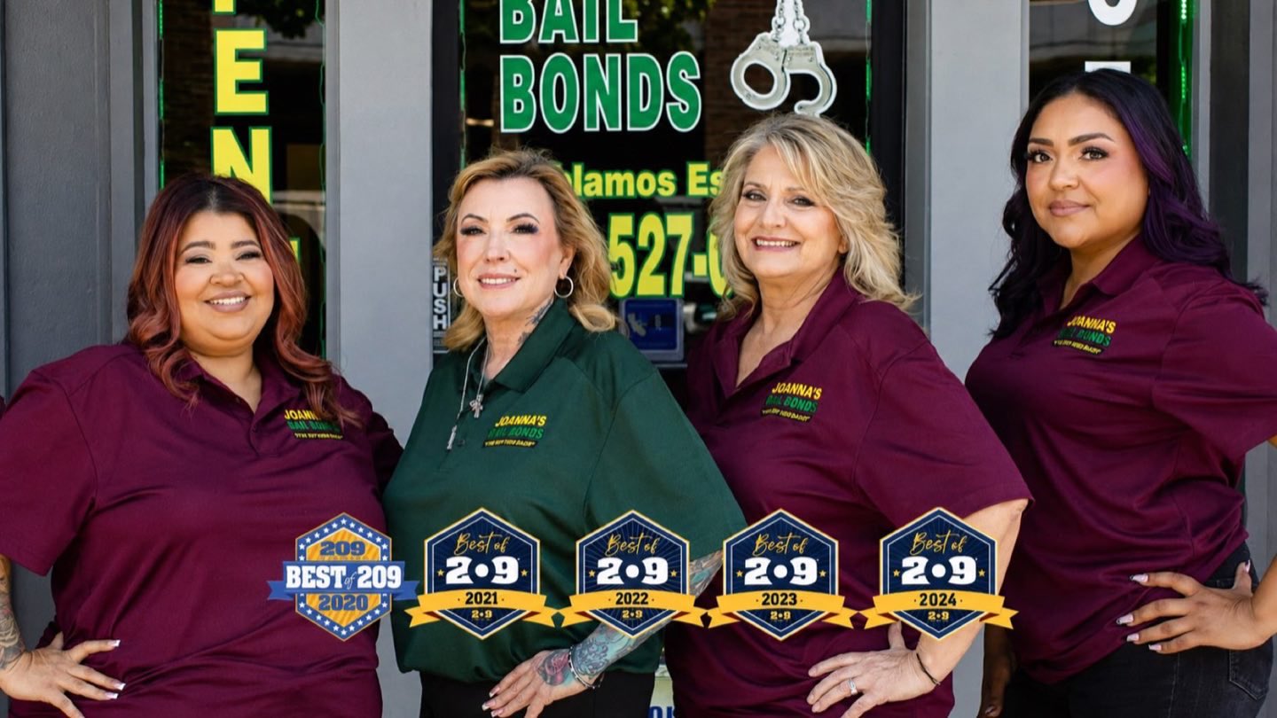 The women of Joanna's Bail Bonds outside their Modesto office, with Best of 209 awards